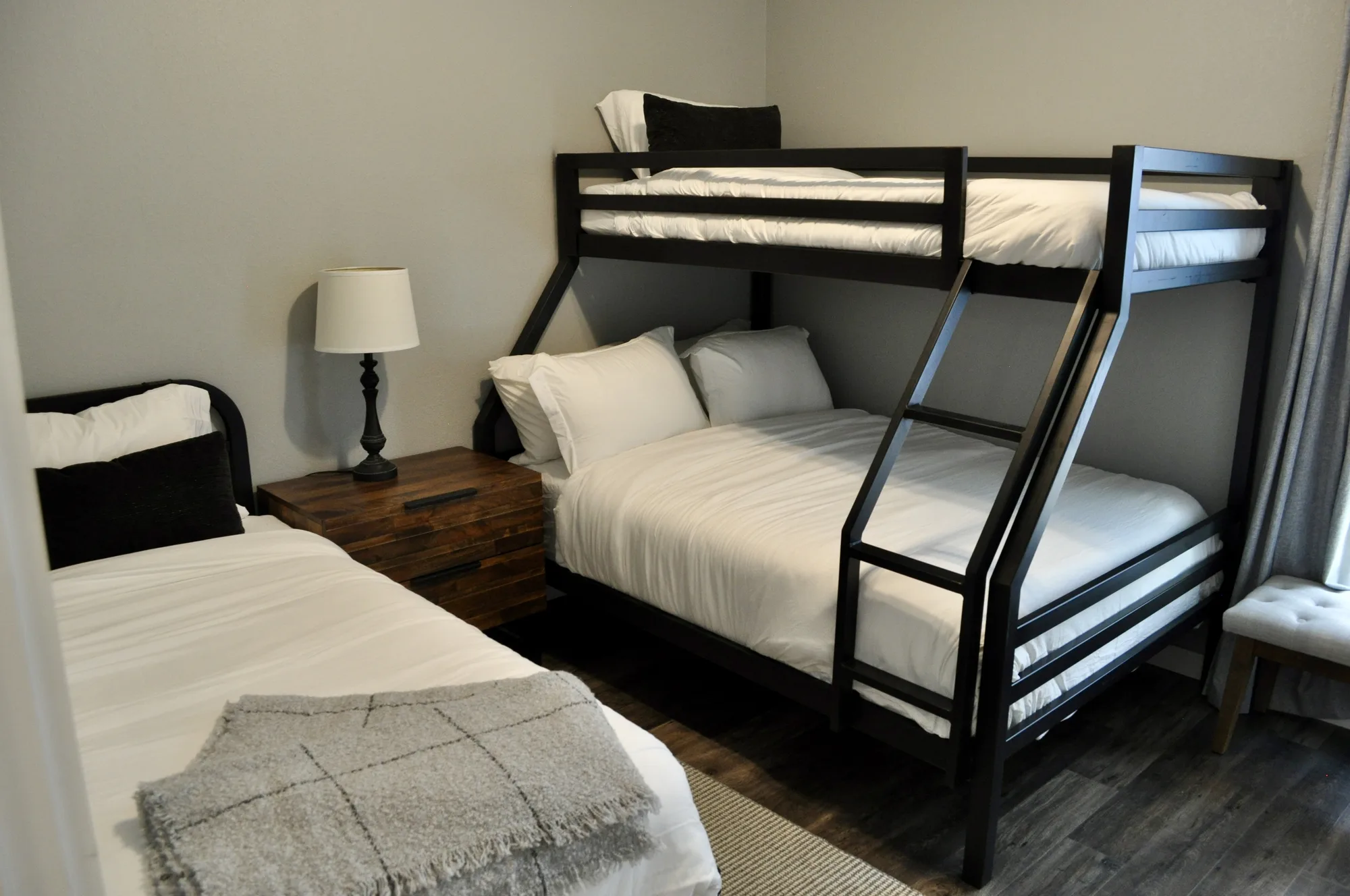 Bunk room with twin-over-full bunk plus twin bed