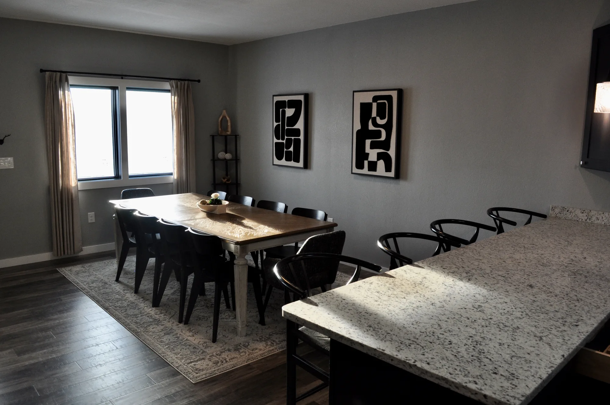 Farmhouse dining table seating eight with curated modern art