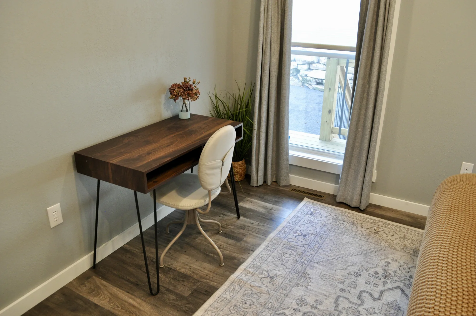 Dedicated workspace with walnut desk and deck view